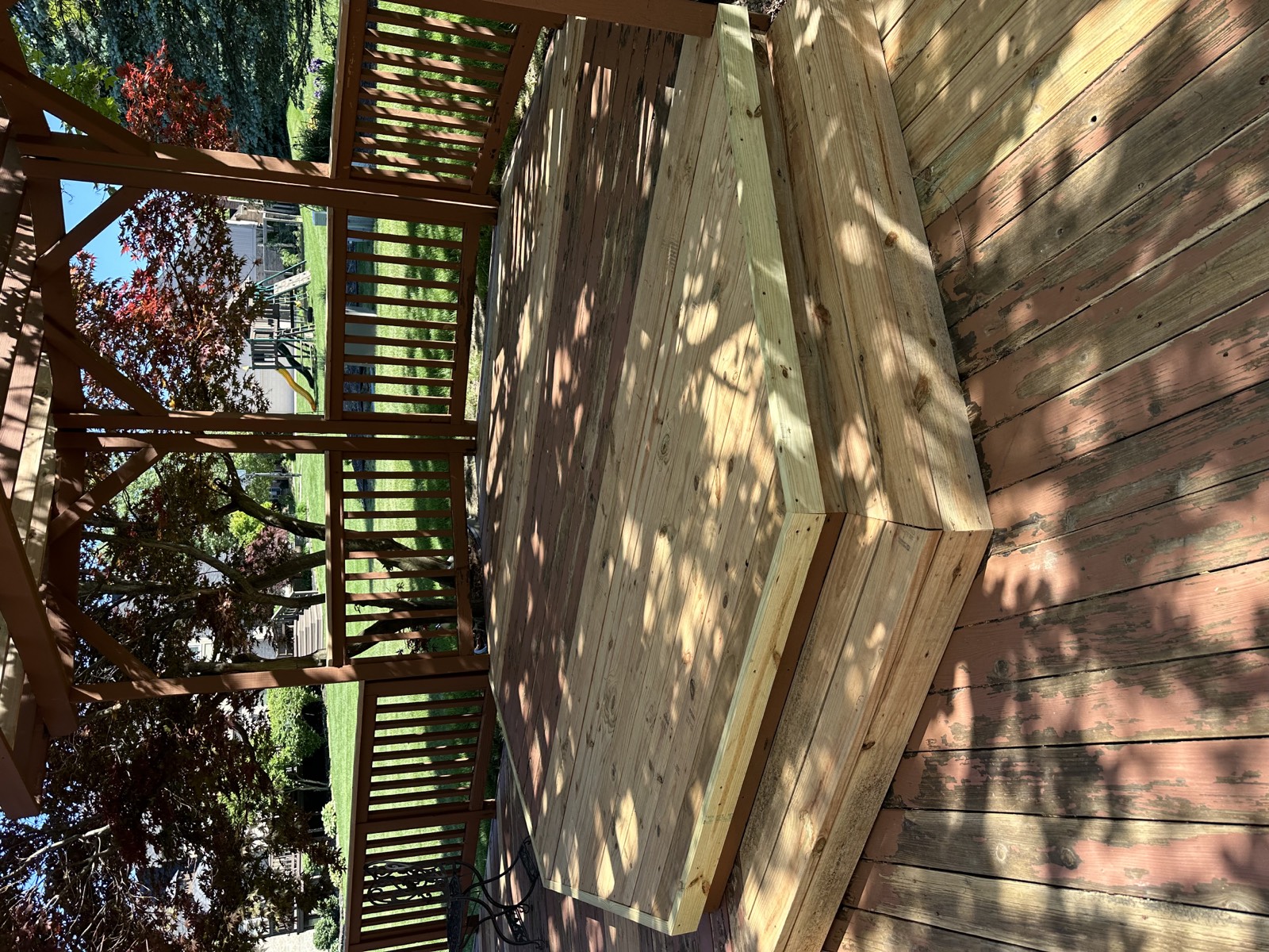 New two-step platform built under a pergola on an existing deck